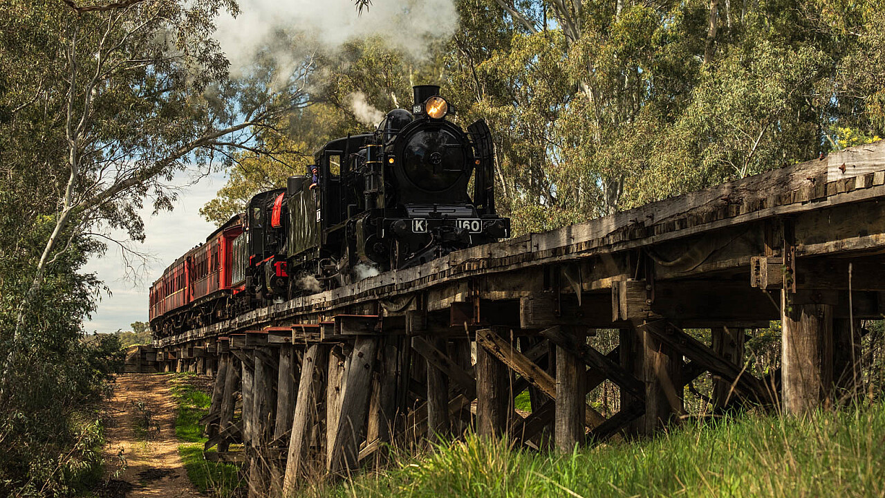 Steam Train crossing trestle bridge